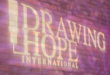 Drawing Hope Logo on a wall